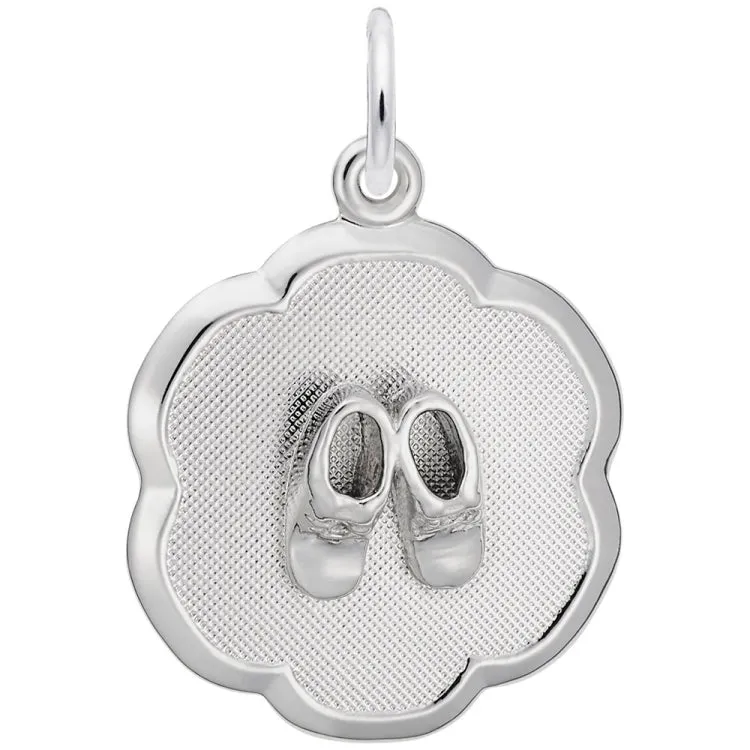 SILVER BABY BOOTIES ON SCALLOPED DISC CHARM